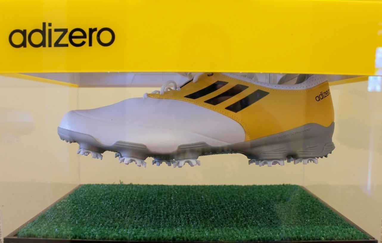 The press kit — the adizero shoe floating inside a light-up box
