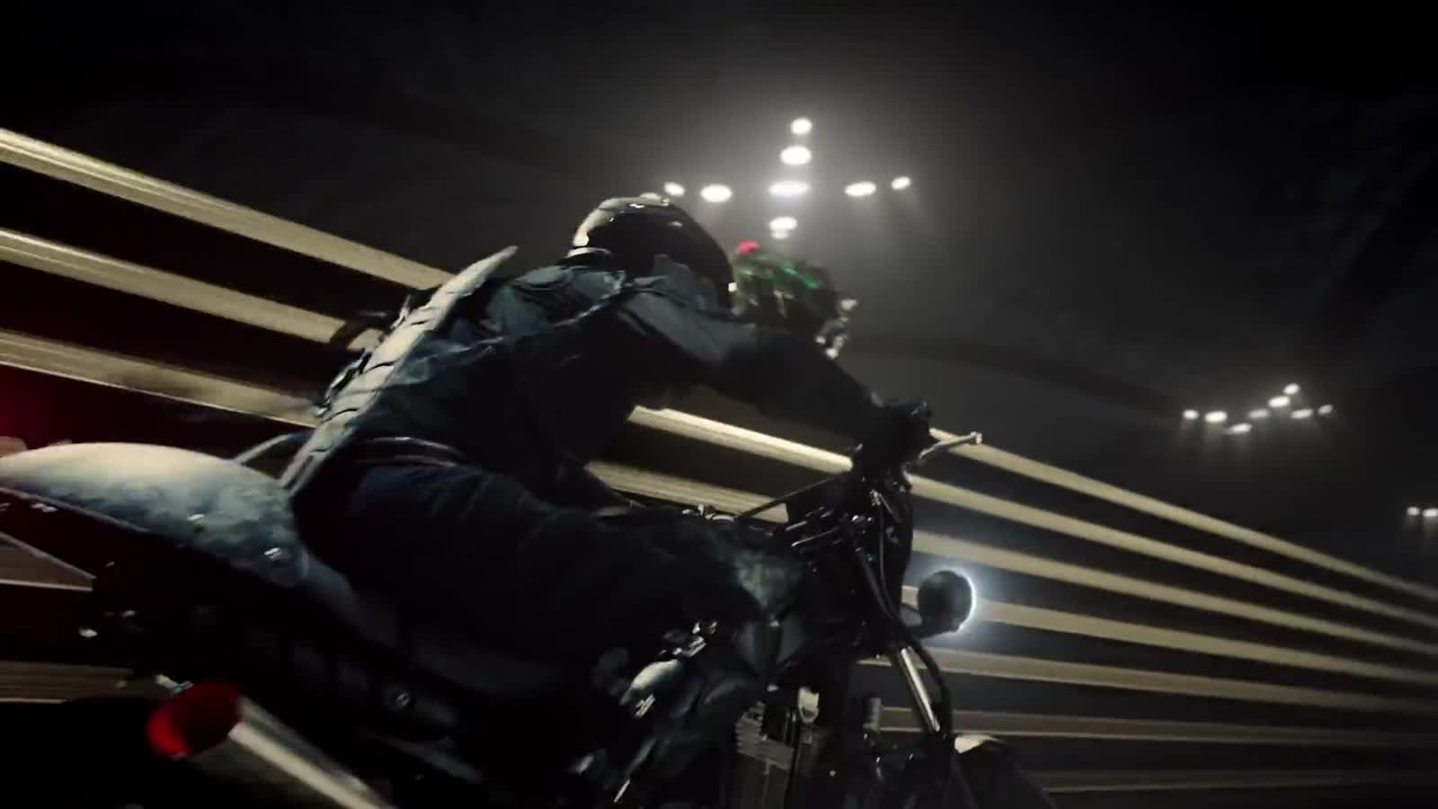 The messenger racing on a motorcycle through streaks of light